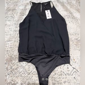 Dynamite wrap sleeveless bodysuit in jet black. Material polyester. Size XXS.